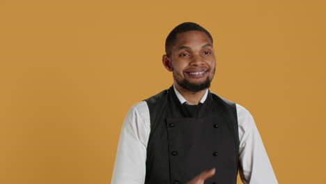 Portrait-professional-server-posing-with-confidence-with-arms-crossed-in-studio