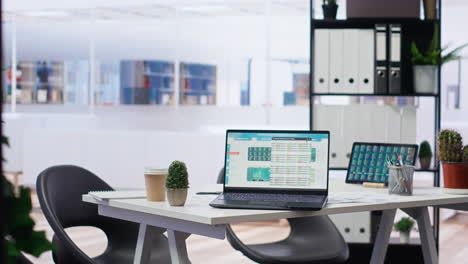 Empty-office-with-stock-exchange-portfolio-on-devices