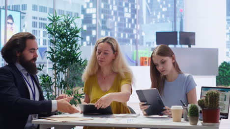 Parent-and-girl-writing-signature-on-paperwork-to-receive-loan