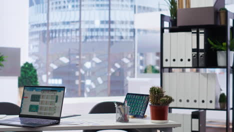 Empty-company-financial-department-with-stock-portfolio-on-laptops