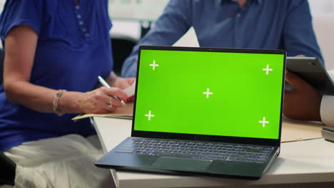 Financial-banker-works-with-a-copy-space-on-tablet-with-his-elderly-clients