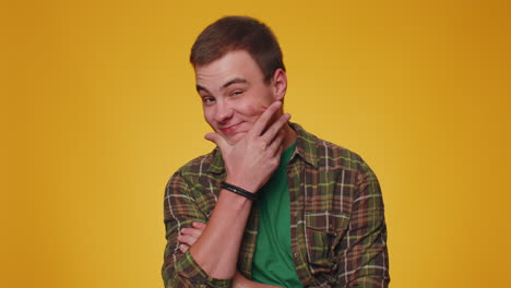 Cheerful-lovely-teenager-adult-man-fashion-model-in-shirt-smiling-and-looking-at-camera-alone