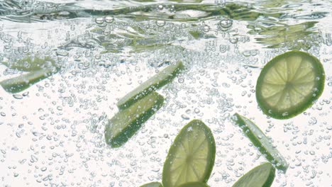 Lime-Slices-falling-deeply-under-water.-Shot-on-super-slow-motion-camera-1000-fps.