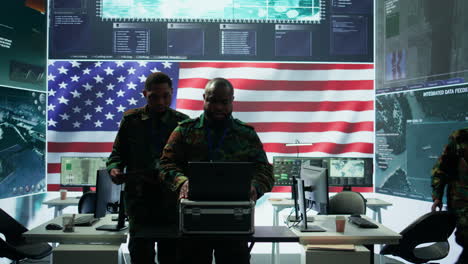 Military-officer-in-a-high-tech-control-center-engages-in-cybersecurity-operations