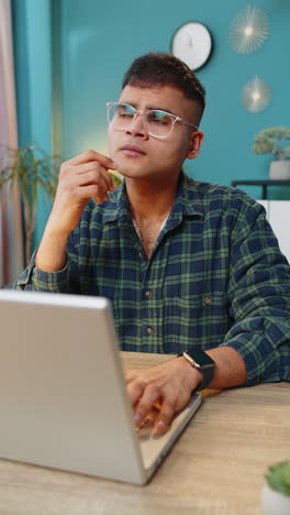 Inspired-happy-man-make-Eureka-gesture-raises-finger-came-up-with-creative-plan-working-on-laptop