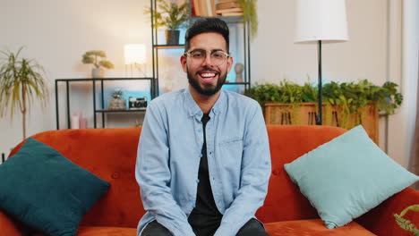 Indian-man-laughing-out-loud-after-hearing-ridiculous-anecdote-funny-positive-joke-at-home-room