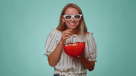 Woman-in-3D-glasses-eating-popcorn-watching-interesting-tv-serial,-sport-game,-film,-online-movie