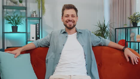 Close-up-portrait-of-happy-smiling-caucasian-man-in-shirt,-looking-at-camera,-celebrate-good-news