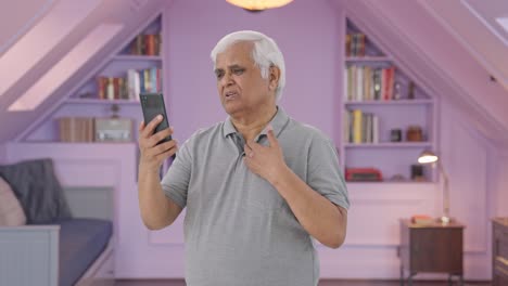 Indian-old-man-talking-on-video-call