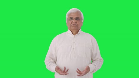 Sad-Indian-old-man-talking-to-someone-Green-screen