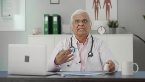 Angry-Indian-senior-doctor-explaining-reports-to-the-patient