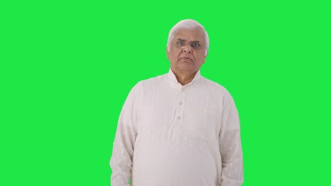 Sad-Indian-old-man-watching-something-tragic-Green-screen