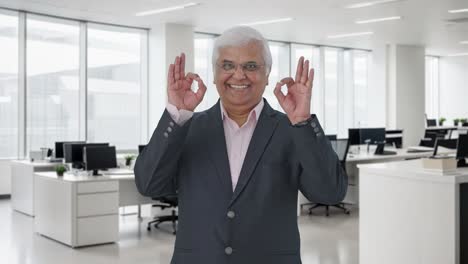 Happy-Indian-senior-manager-showing-okay-sign