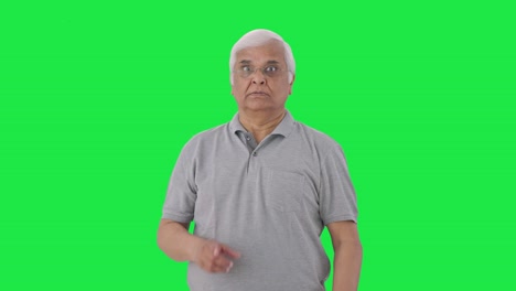 Angry-Indian-old-man-shouting-to-someone-Green-screen