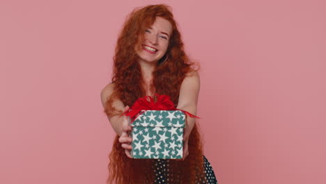 Redhead-ginger-girl-presenting-birthday-gift-box-offer-wrapped-present-career-bonus-celebrating