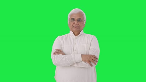 Confident-Indian-old-man-standing-crossed-hands-Green-screen