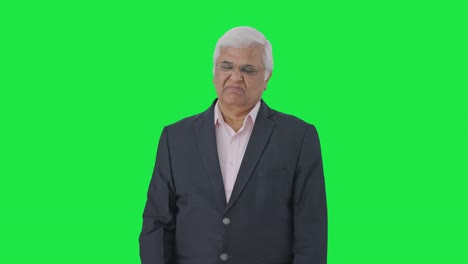 Upset-Indian-senior-manager-slapping-his-head-Green-screen