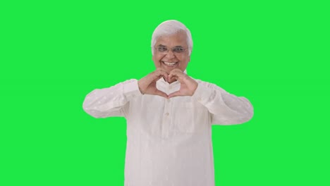 Happy-Indian-old-man-showing-heart-sign-Green-screen