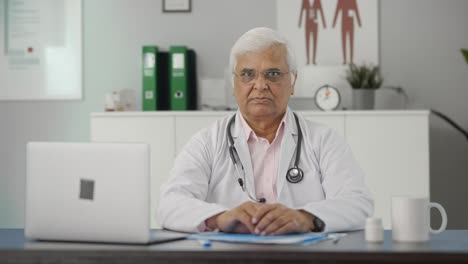 Angry-Indian-senior-doctor-staring-at-the-camera