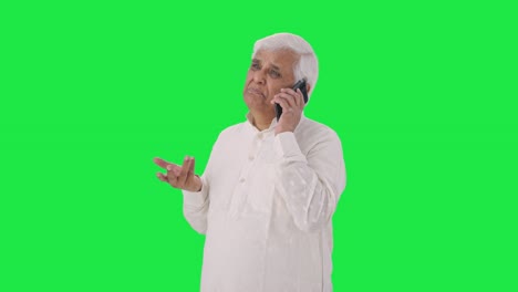 Indian-old-man-talking-on-phone-Green-screen