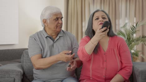 Indian-old-couple-fighting-for-TV-remote