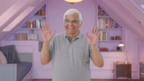 Happy-Indian-old-man-saying-hello-and-waving