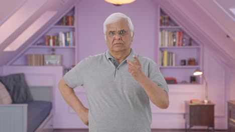 Angry-Indian-old-man-looking-at-the-camera