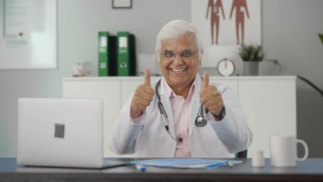 Happy-Indian-senior-doctor-showing-thumbs-up