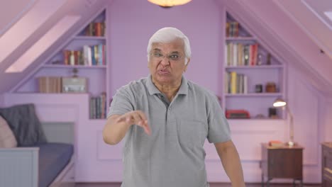 Angry-Indian-old-man-stopping-someone