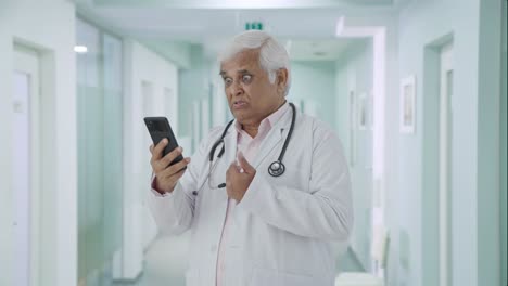 Angry-Indian-senior-doctor-consulting-patient-over-video-call