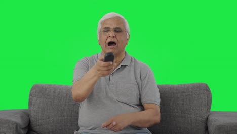 Sleepy-Indian-old-man-watching-TV-Green-screen