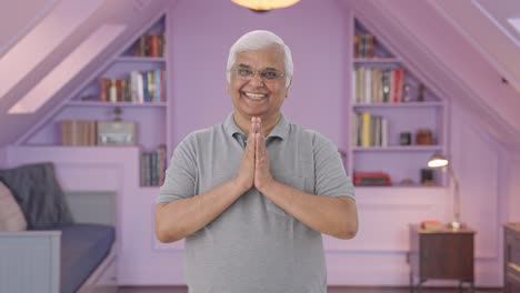 Happy-Indian-old-man-doing-Namaste-and-greeting