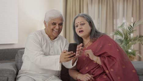 Happy-Old-Indian-husband-clicking-picture-of-his-wife