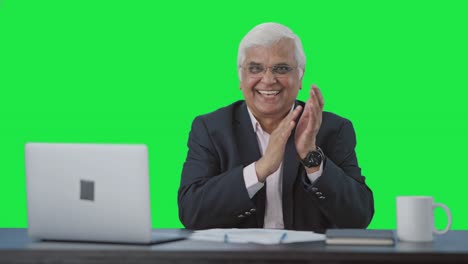 Happy-senior-Indian-businessman-clapping-and-appreciating-Green-screen