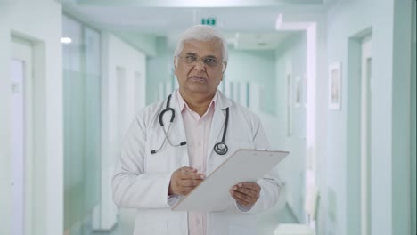 Indian-senior-doctor-talking-to-the-patient