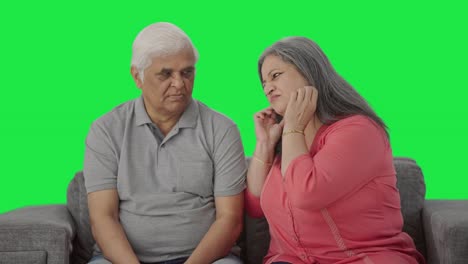 Guilty-Indian-old-wife-saying-sorry-to-her-husband-Green-screen