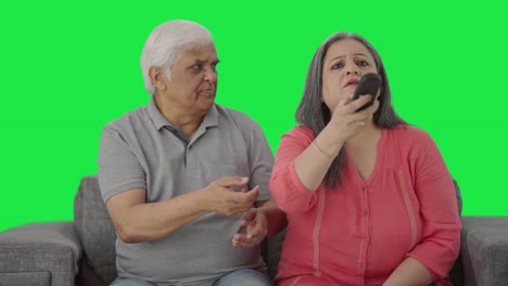 Indian-old-couple-fighting-for-TV-remote-Green-screen