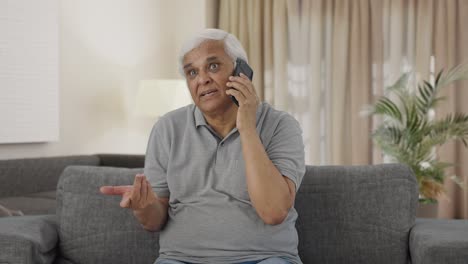 Angry-Indian-old-man-shouting-on-phone