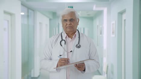 Indian-senior-doctor-listening-to-the-patient