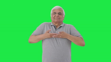 Relaxed-Indian-old-man-doing-breathe-in-breathe-out-exercise-Green-screen