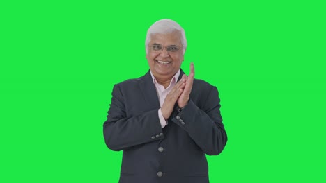 Happy-Indian-senior-manager-clapping-and-appreciating-Green-screen