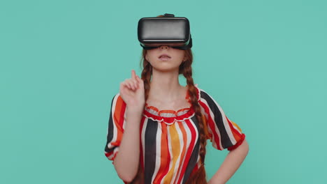 Child-girl-in-helmet-play-simulation-realistic-game-presses-imaginary-buttons-virtual-reality-video