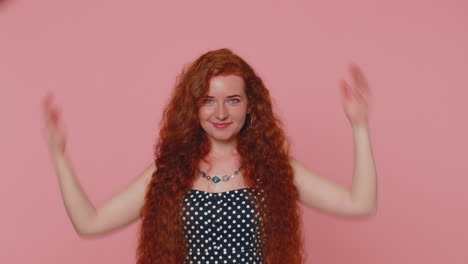 Redhead-woman-playing-childish-catching-up-game,-feeling-in-safe-making-roof-above-head-with-hands