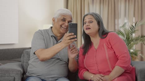 Cute-Old-Indian-husband-clicking-pictures-of-his-wife