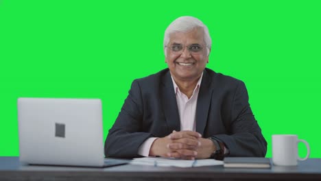 Happy-senior-Indian-businessman-smiling-to-the-camera-Green-screen