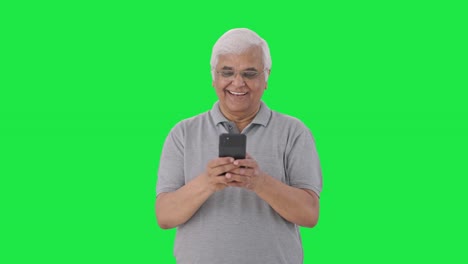 Happy-Indian-old-man-chatting-with-someone-Green-screen