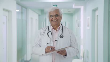 Happy-Indian-senior-doctor-listening-to-the-patient