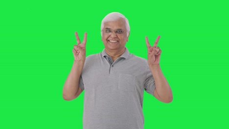 Happy-Indian-old-man-showing-victory-sign-Green-screen