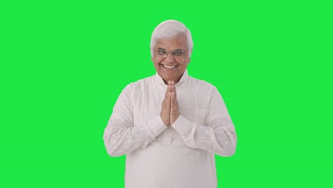 Happy-Indian-old-man-greeting-and-doing-Namaste-Green-screen