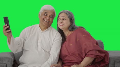 Cute-Old-Indian-couple-clicking-selfies-Green-screen